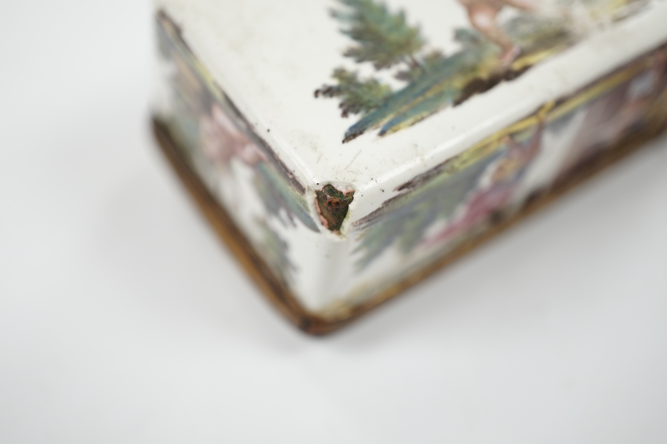 An 18th century French enamel snuff box and a late 19th century silver mounted porcelain scent bottle, largest 7.5cm. Condition - box poor, scent bottle fair